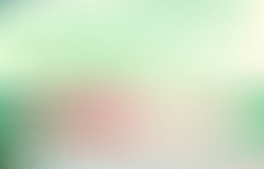 very blurry, making it difficult to discern any specific details or objects. It appears to have a mix of light green and white colors, with a hint of red or pink in the center