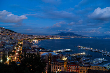panoramic cityscape Naples with Vesuvius volcano at night, Italy
