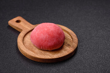 Delicious colorful asian mochi sweets with rice dough shell and fruit filling
