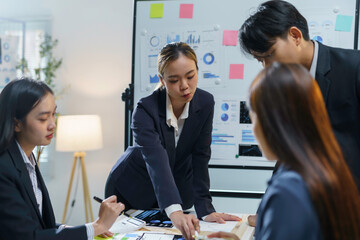 Team of asian businesspeople are having a meeting and brainstorming, working on a new project