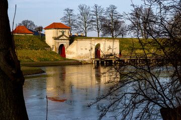 dog-front

10:14 pm

In the afternoon light, the historical fortress of Kastellet in Copenhagen, Denmark, stands tall, reflecting its ancient architecture on the aqua-colored pond. This Nordic bastion
