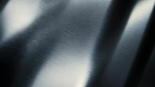 A close-up image of brushed metal reflecting light