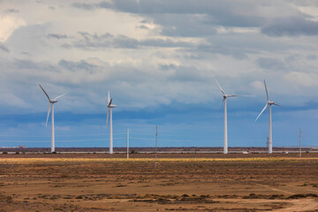 Wind turbines against a gloomy sky