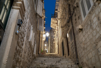 A narrow steep street of the old town in Dubrovnik at night, Croatia.