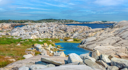 Breathtaking landscapes of eroded rock, boulders, tidal pools and grass patches in Peggy's Cove, Nova Scotia, Canada
