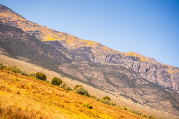 Landscape with a twist, mountains, prairie and blue sky