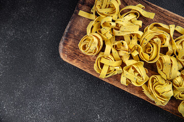 tagliatelle with chia seeds raw pasta vegetable dish Fresh delicious gourmet food background On the...