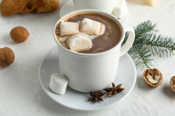 Mug of tasty Christmas cocoa with marshmallows on white background