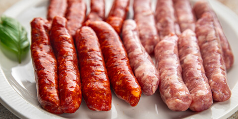 raw sausages beef, pork, chicken, lamb, dish fresh delicious gourmet food background on the table rustic food top view copy space
