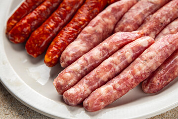 raw sausages beef, pork, chicken, lamb, dish fresh delicious gourmet food background on the table rustic food top view copy space
