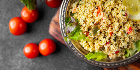tabbouleh couscous bulgur vegetable dish fresh vegetarian vegan food gourmet food background on the table rustic food top view copy space keto and paleo diet