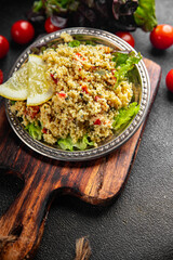 tabbouleh couscous bulgur vegetable dish fresh vegetarian vegan food gourmet food background on the table rustic food top view copy space keto and paleo diet