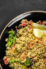 tabbouleh couscous bulgur vegetable dish fresh vegetarian vegan food gourmet food background on the table rustic food top view copy space keto and paleo diet