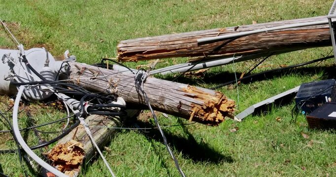 Strong winds of hurricane caused electric poles to crash down break their wires during storm