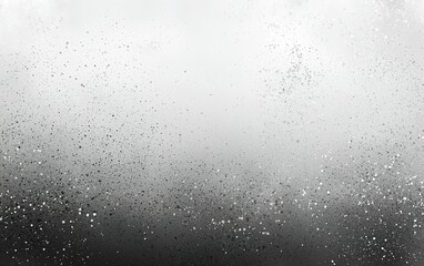 Abstract monochrome texture of scattered particles creating a misty atmosphere in a grayscale palette