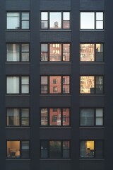 Fototapeta premium Urban Reflections A Study of Windows and Light Within a Dynamic Cityscape Environment