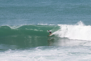 Surfer in a wave about to close in VVF, Anse l'etang, tartane, Martinique, West Indies, France
