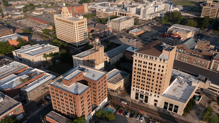 Monroe, Louisiana, USA - April 4, 2024: Afternoon sunlight shines on the historic buildings in the skyline of downtown Monroe.