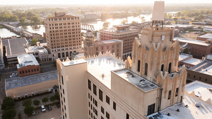 Monroe, Louisiana, USA - April 4, 2024: Afternoon sunlight shines on the historic buildings in the...