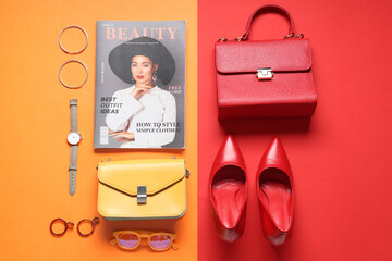 Stylish bags, magazine and different accessories on color background