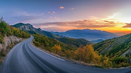 Naklejka premium Serene Mountain Road at Sunset
