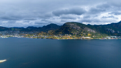 Aerial View of Coastal Village with Autumn Foliage in Norwegian fjords