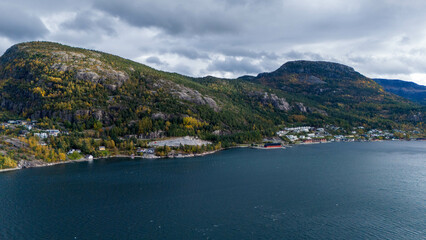 Aerial View of Coastal Village with Autumn Foliage in Norwegian fjords