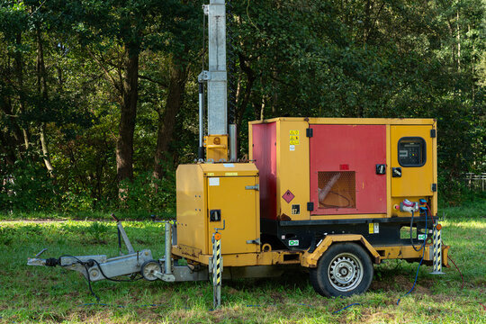 Mobile generator on a construction site in a forested area