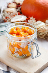 Pumpkin preserves in a glass jar.