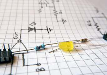 Electronic circuit elements on a drawing circuit diagram. Electronic experiments and workshop. 