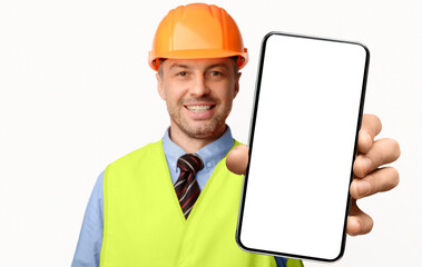 Building Services. Construction Worker Showing Cellphone Empty Screen Smiling To Camera Standing On...