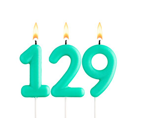 Birthday number 129 - Green birthday candle on white background