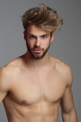 Fototapeta premium Handsome man with topless body. Muscular torso. Strong brutal guy. Portrait of handsome sexy man. Muscular model. Handsome young man with naked body, bare torso, undressed. Sexy man.