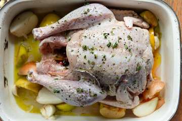 Raw turkey prepared in a roasting pan before going into oven for Thanksgiving or Christmas