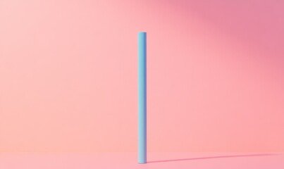 A light matte blue stick standing vertically on a pastel pink surface creating a soft, minimalistic indoor aesthetic