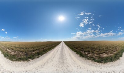 panorama of a deserted white sand gravel road bordered by fields under a clear sky with sparse clouds