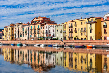 Beautiful view of the picturesque town of Bosa with its colorful houses reflected in the Temo River, Sardinia, Italy.