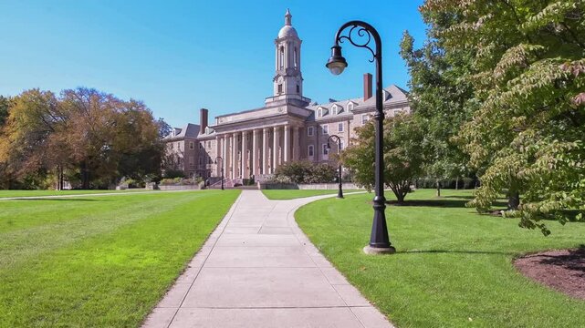 The Old Main building on the campus of Penn State University in sunny day in State College, Pennsylvania.
