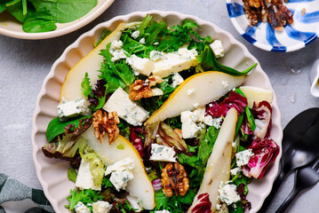 Salad with pear, blue cheese and walnuts.. selective focus