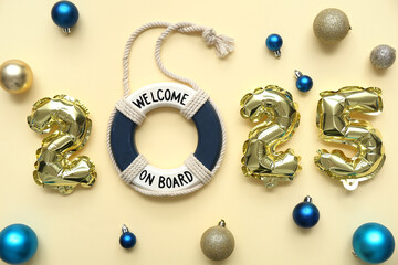 Figure 2025 with decorative ring buoy and Christmas balls on yellow background