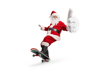 Santa claus riding a skateboard and gesturing thumbs up