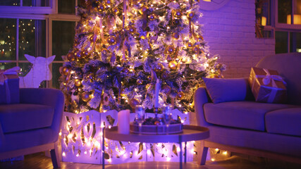 Beautifully decorated christmas tree is illuminating a cozy living room with its warm, inviting glow, creating a festive atmosphere