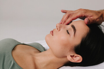 Naklejka premium Post-surgery rhinoplasty care. Preventing swelling, deforming and additional complications with special nose band aid. Woman is having her nose taped after nose surgery.