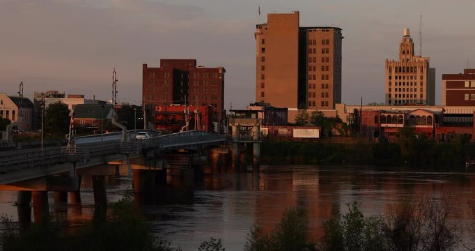 Monroe, Louisiana, USA - April 4, 2024: Afternoon sunlight shines on the historic buildings in the skyline of downtown Monroe.