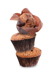 Stacked tasty chocolate chip muffins on white background