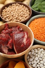 Different products rich in iron on table, closeup