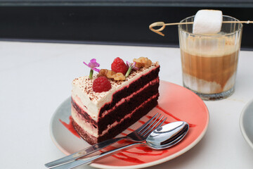 Red Velvet Cake with raspberry, red sponge cakes and cream cheese frosting. Modern Dessert. Festive layered