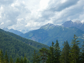 The Stubai Valley showcases the striking peaks of the Austrian Alps beneath a dramatic sky. Tall...