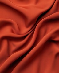 Fototapeta premium Elegant orange fabric texture, smooth and flowing, white background.