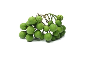 A cluster of small, round, green fruits, commonly known as turkey berries or mini-eggplants, is shown against a white background.